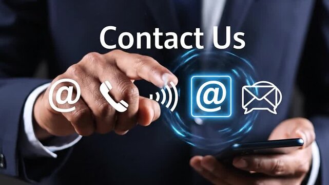 Businessman finger touches glowing blue symbol buttons showing contact us options like email phone chat on futuristic touchscreen interface