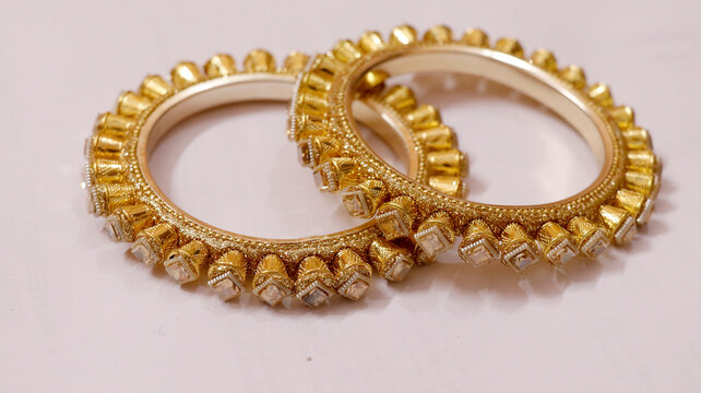 often referred to as Kadas or Pacheli bangles in traditional Indian jewelry background