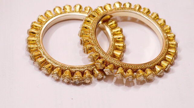 often referred to as Kadas or Pacheli bangles in traditional Indian jewelry background
