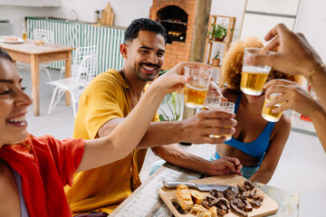 Group of four friends enjoying drinks together in Rio de Janeiro