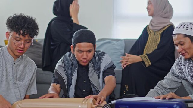 Muslim family preparing suitcases for Mudik homecoming trip