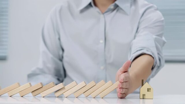 House protection concept miniature home with hands insurance concepts, symbolizing risk assessment, property protection, home reconstruction, disaster recovery, real estate investment planning