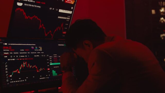A powerful cinematic shot of a distressed trader in a dark office, illuminated by the red glow of failing market charts as he reacts to a financial crisis