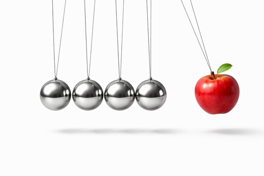 Newton&rsquo;s cradle with an apple replacing a metal ball, representing change, innovation, and standing out concept