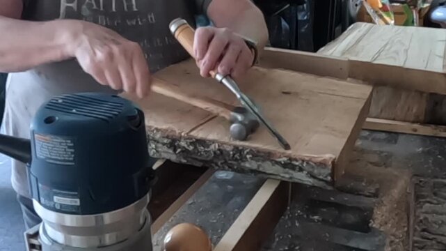 Women uses a chisel on raw oak wood