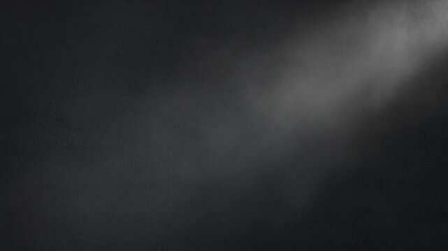 A dark mysterious fog rolls over mountains under a gloomy sky