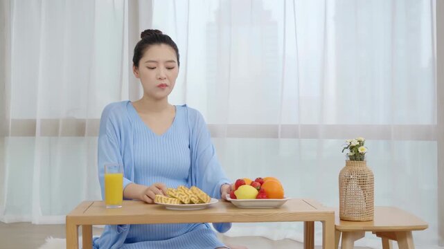 Young pregnant woman eating healthy fresh tasty food meal with lots of fruit vegetables diet pregnancy girl taking care her body and healthy lifestyle of motherhood before childbirth concept