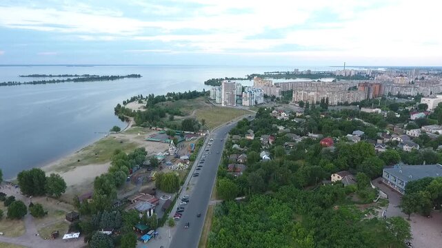 Aerial View of Cherkasy City Coastline with Dnipro River Beach and Amusement Park at Sunset