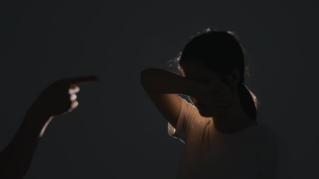 Women victim of violence abused concept. Stressful depressed young woman crying sadly covering her face with her hands from domestic violence, depressive state, mental health problem, severe stress