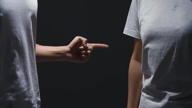 Unhappy couple yelling man and woman arguing, blaming, disputing, insults, complaints, looking dejected angry in dark light, domestic violence abused and relationship problems concept