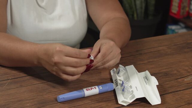 Female preparing Semaglutide GLP-1 pen for self-administered injection at home, obesity treatment