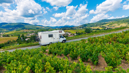 Naklejka premium Motor home driving on the road in France, Burgundy, vineyard
