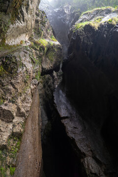 Cascate Varone gorge with natural rock walls and soft light in narrow cave parco grotta Trentino Italy
