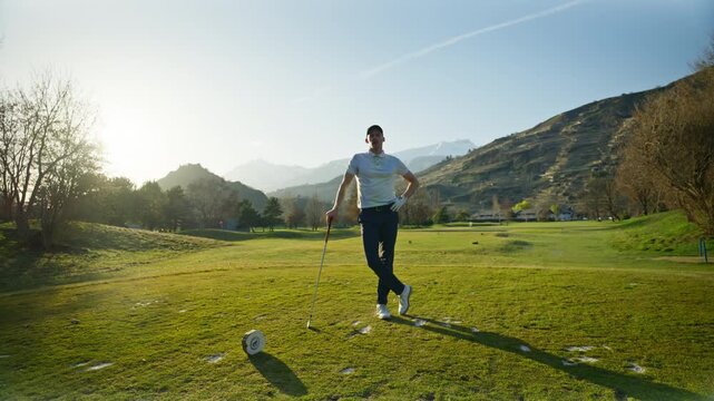 Portrait shot of a golfer standing on the course in Sion, Switzerland. Cinematic sports moment capturing focus, confidence, and the calm atmosphere of an alpine golf setting.
