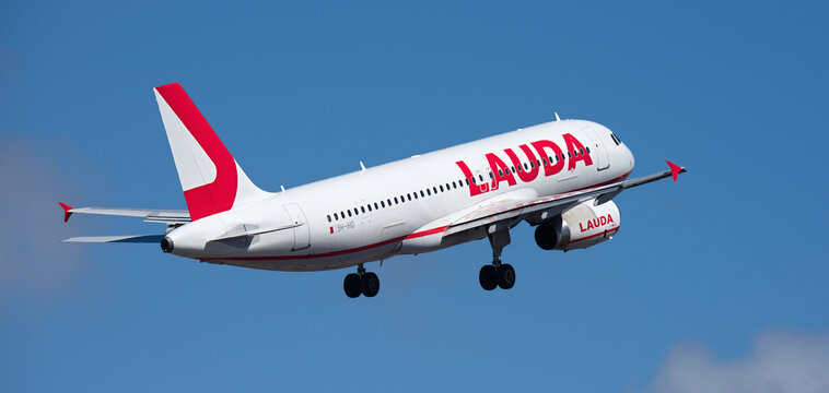Tenerife, Spain March 11st, 2026. Airbus A320-232 Lauda airlines, flies in the blue sky. Takeoff at Tenerife Airport. Retracting the landing gear