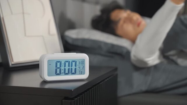 Morning of overslept falling asleep young woman waking up to missed alarm near bed, getting late work, morning stress, getting out of bed in a hurry running late for work, appointment or class study