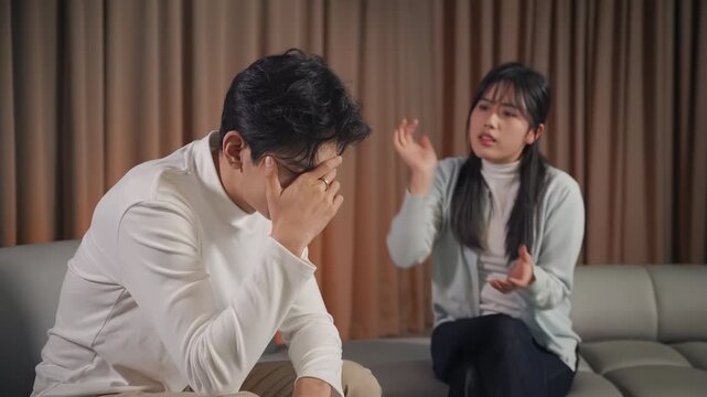 Unhappy couple family husband wife yelling woman and man arguing, blaming, disputing, insults, complaints, looking dejected angry in dark light, domestic violence abused, relationship problems concept
