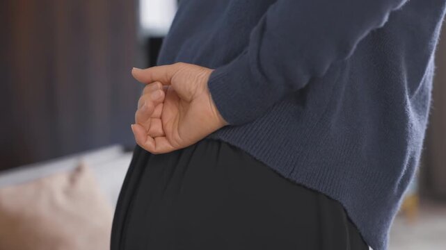 Senior mature woman experiencing lower back pain backache expression, symptom painful spinal ache, rubbing stiff aching muscles, low-back lumbar pain sitting in incorrect sedentary posture, backache