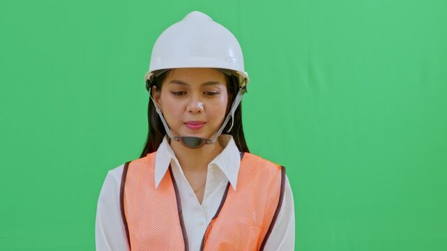 The engineer turns her head sharply in response to a sudden sound or danger. Ideal for emergency, alarm, or site accident scenario videos.
