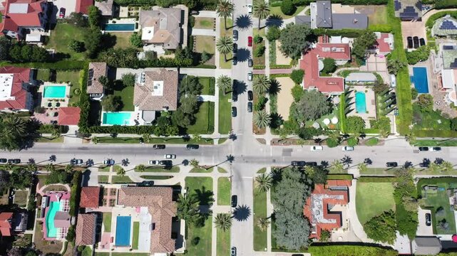 Aerial view of luxury Beverly Hills residential neighborhood with palm trees and pools