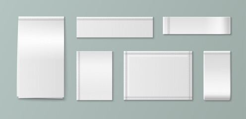 Naklejka na ściany i meble White fabric label mockup with realistic woven texture. Blank cotton tag sewn on cloth garment with detailed stitching, vector set isolated on background. Brand identity and apparel design product