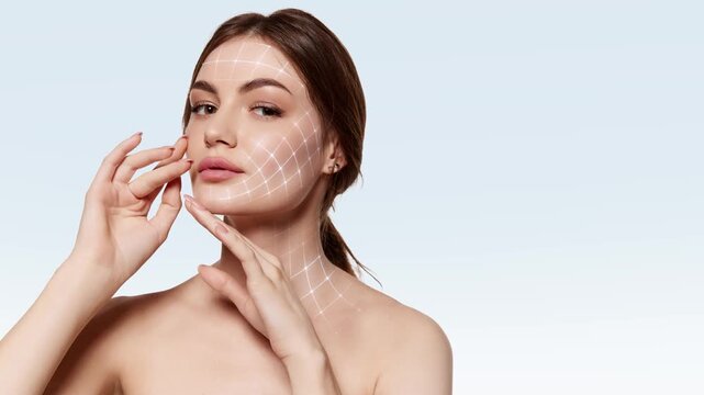 Woman gently touching face with glowing grid mapping on clean background. Concept of skincare routine, product application, digital facial care, anti aging treatment and beauty ritual.
