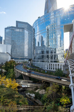 Glass highrise towers over elevated roadway in the La Defense business district Paris France showing modern skyline urban infrastructure and architecture