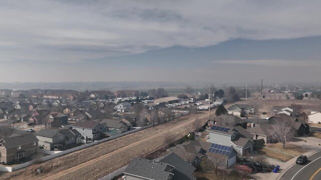 Nebraska wildfire chokes Northern Colorado in a brown cloud of smoke. Mountains barely visible through smog.