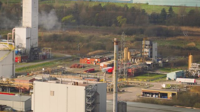 Funnel releasing steam from biomass energy facility converting recycled wood waste and timber scraps into clean electricity. Sustainable infrastructure and green energy production.