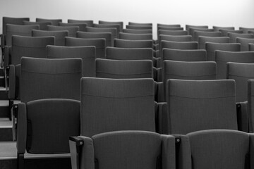 Fototapeta premium Modern Empty Conference Hall Seats. Comfortable Auditorium Seating in Business Event Venue, Corporate Seminar or Theater Room Interior, Professional Setup for Presentation or Meeting Use