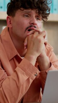 Caucasian businessman typing laptop holding head thinking problem tired stressed business man with computer suffering failure complicated work task male guy working fail startup bankruptcy in office