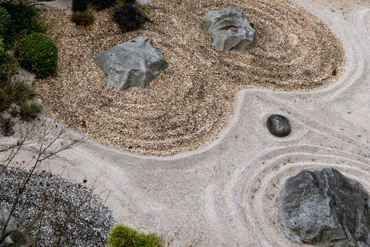 zen garden sand patterns with stones minimal landscape botanical garden varone waterfall park trentino alto adige italy