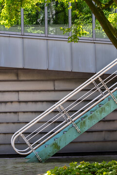 Modern minimal stairs with metal railing outdoors in abstract architecture expressing up direction and growth with clean geometry for progress mindset
