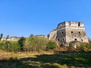 Fototapeta premium Panoramic view of Toky Castle ruins. Medieval Ozhyhivtsi fortress on a sunny day in Ternopil region, Ukraine.
