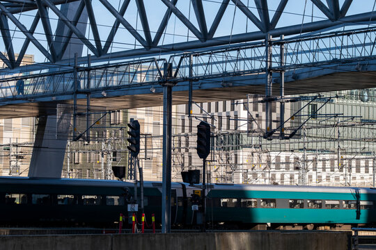 Modern train at railway station platform showing transit infrastructure for urban travel in Oslo Norway with steel lines and geometry