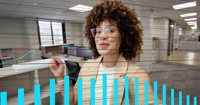 Approaching handheld camera woman wearing sleeveless vest in office filming and explaining overlays