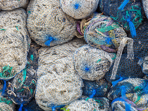 Tangled fishing nets piled at Cagnano Varano port