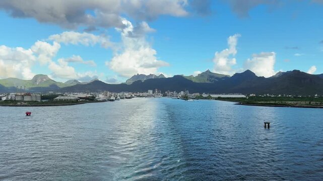 Sailing out of Port Louis harbour panning right from the aft of the ship towards other ships anchored off shore