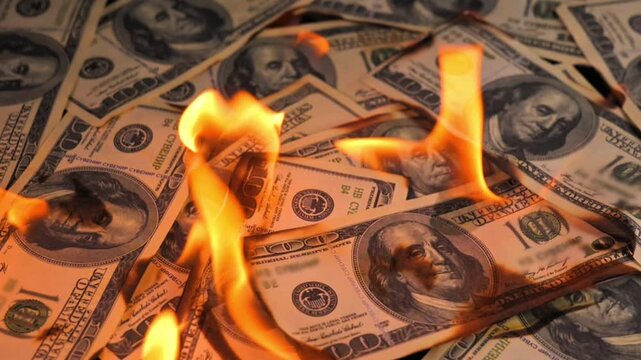 Burning US Dollar Banknotes Close Up Money Loss and Financial Crisis Concept