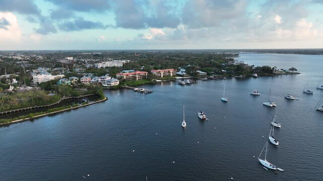 A tranquil drone shot above the North Fork in St. Lucie River showcasing the waterfront neighborhoods of Stuart.