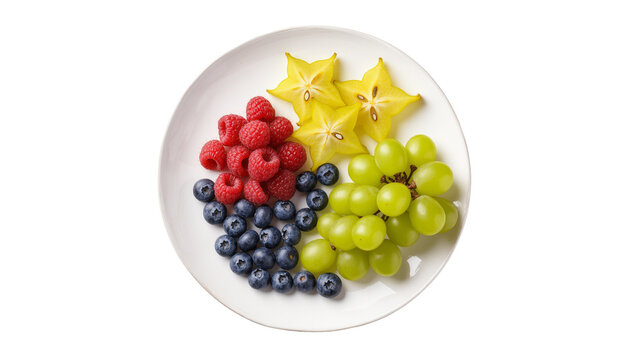 Isolated plate of fresh mixed fruits including raspberries, blueberries, star fruit, and green grapes