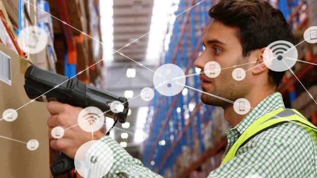 Vertical video: Man scanning boxes pressing button creating IoT links to racks checking depot stock