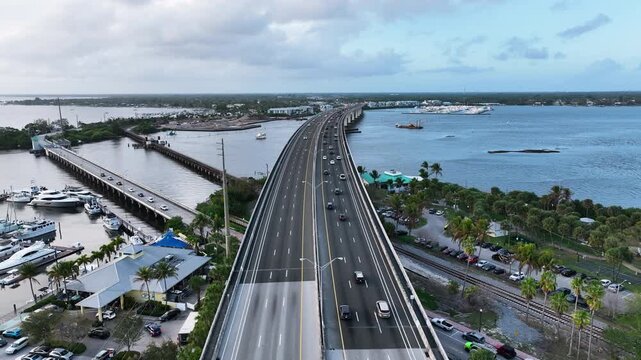 Aerial view over cars driving on the Roosevelt Bridge near downtown Stuart, Florida.