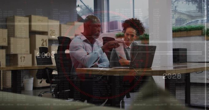 Vertical video: Mentor pointing at laptop triggers HUD timeline while peer reviewing company growth