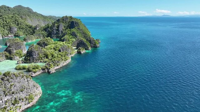 Papua; sea; sun; air; water; color; green; blue; west; forest; holiday; travel; boat; yacht; live; cloud; southwest; Pacific; New Guinea; island; Indonesia; Australia; Solomon Islands