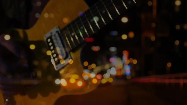 Guitarist entering frame, fretting and picking guitar for music, revealing fretboard and bokeh