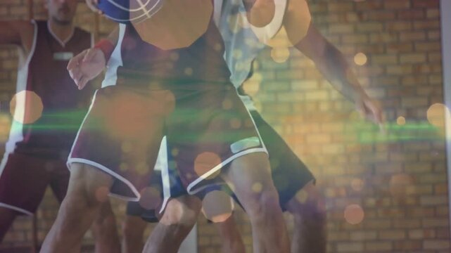 Maroon guard dribbling blue white basketball on court drawing pressure pivoting to space with bokeh