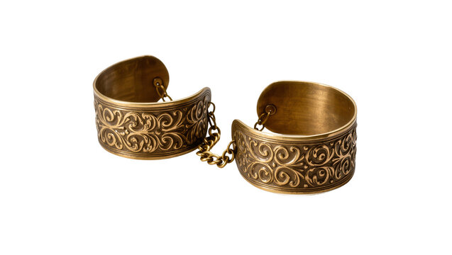 Isolated ornate antique bronze cuffs with a chain, decorative wrist accessories on display