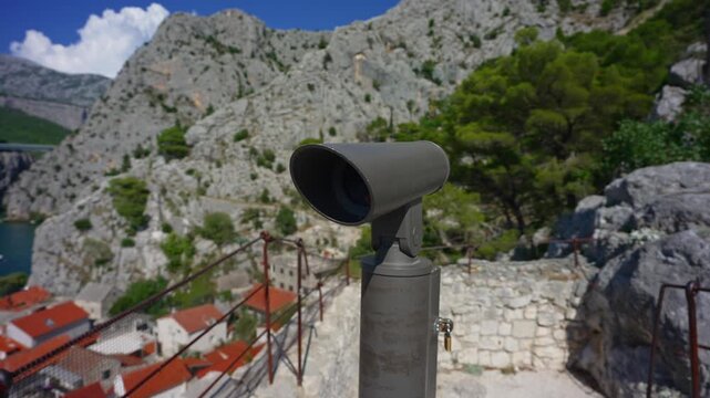 Public monocular telescope for city panoramic view on the tower.