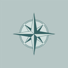 Fototapeta premium Navigation's Guiding Star: A simple, elegant compass rose emblem, poised against a soft background, guides with direction and purpose.